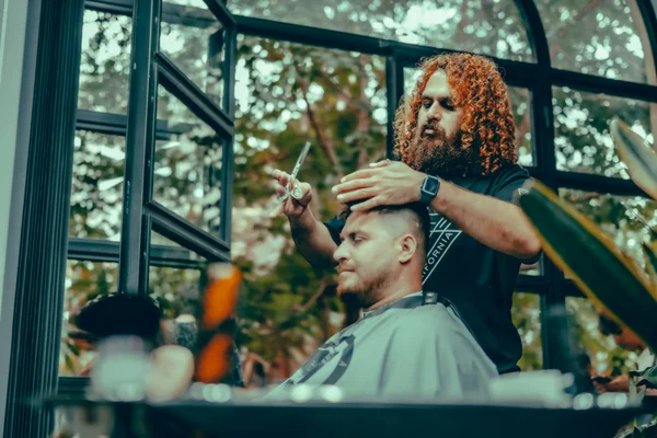 Expert barber providing precision haircut services