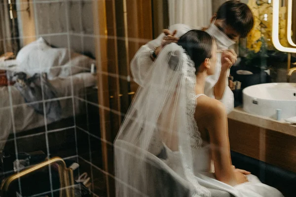 Bridal hair styling session before wedding ceremony